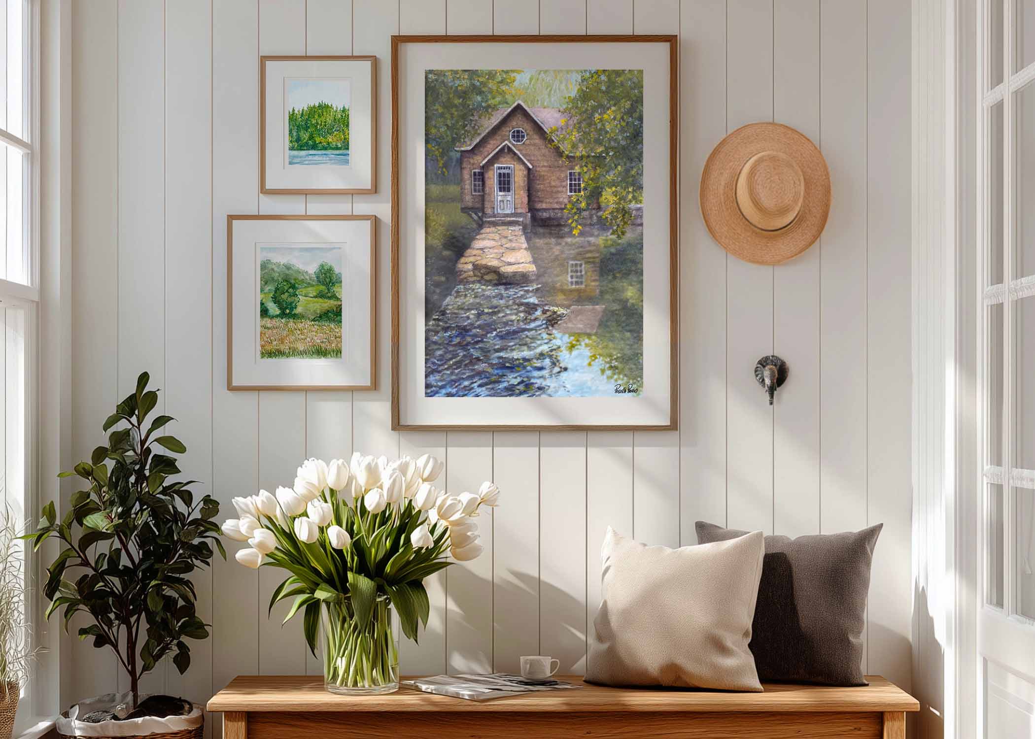 rustic landscape paintings on wall in country entryway